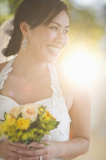 Portrait of bride holding bouquet.