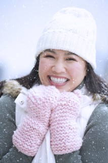 Portrait of happy woman wearing warm clothing.
