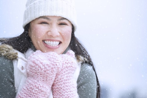 Portrait of happy woman wearing warm clothing.