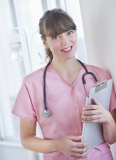 Portrait of smiling female nurse. Photo : Daniel Grill