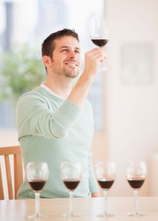 Man tasting wine. Photo : Daniel Grill