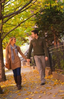 Young couple walking on pavement. Photo: Daniel Grill