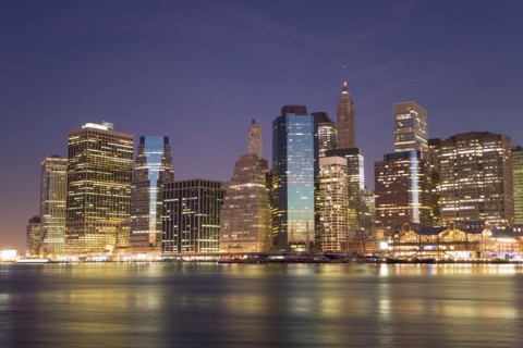 USA, New York State, New York City, City skyline at dusk. Photo: fotog