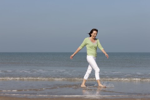 Woman on beach. Photo : Jan Scherders