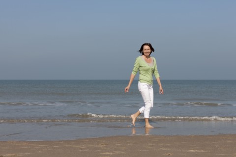 Woman on beach. Photo : Jan Scherders