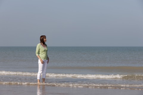 Woman on beach. Photo : Jan Scherders