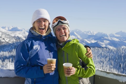USA, Montana, Whitefish, Portrait of two women with mountains as backdrop. Photo : Noah Clayton