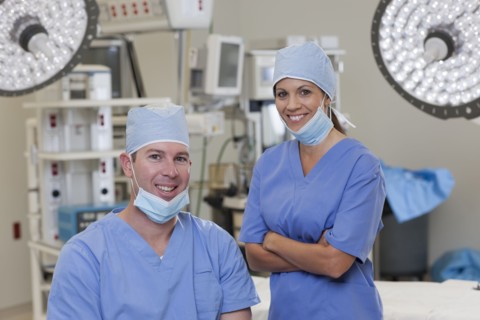Portrait of male and female surgeons in operating room. Photo : db2stock