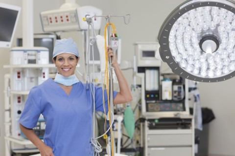 Portrait of female surgeon in operating room. Photo : db2stock