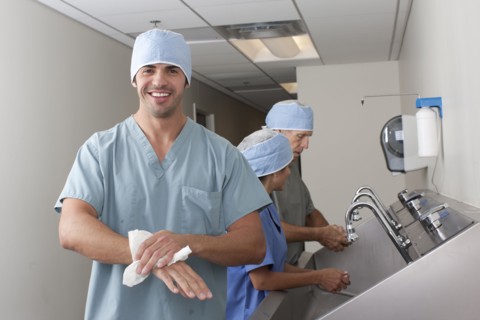 Surgeons washing hands in hospital. Photo : db2stock