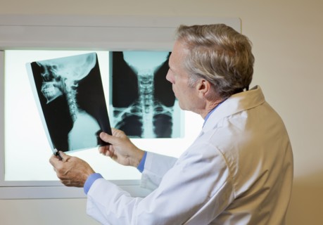 Doctor looking at x-ray. Photo : db2stock