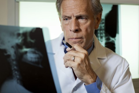 Doctor looking at x-ray. Photo : db2stock