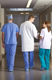 Doctors and surgeons walking in corridor. Photo : db2stock