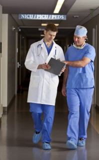 Doctor and surgeon walking in corridor. Photo : db2stock