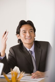 Businessman gesturing. Photo: Rob Lewine