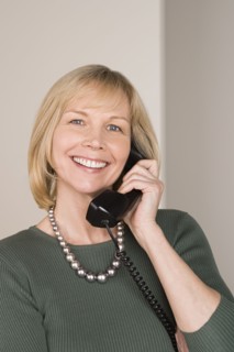 Portrait of businesswoman talking on phone. Photo : Rob Lewine