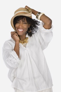Studio portrait of mature woman wearing hat. Photo : Rob Lewine