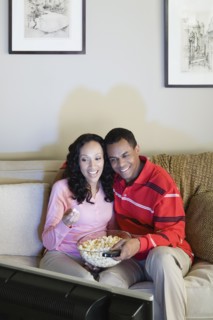 Couple watching tv. Photo : Rob Lewine