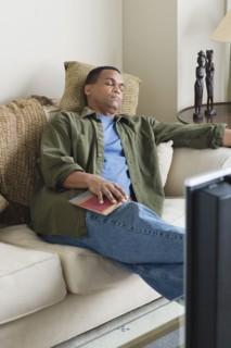 Man napping on sofa. Photo: Rob Lewine