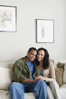 Portrait of couple at home. Photo : Rob Lewine