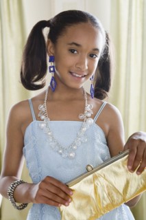 Portrait of girl (10-11) in elegant clothes. Photo : Rob Lewine
