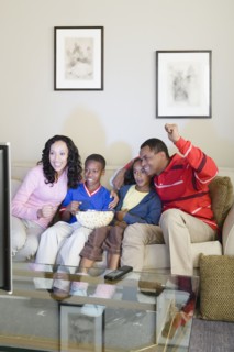 Parents and children (10-13) watching tv. Photo : Rob Lewine