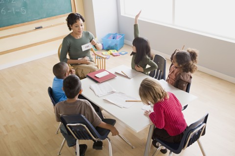 Teacher and children (6-7) at school. Photo : Rob Lewine