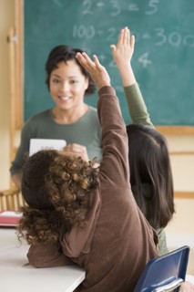 Teacher and children (6-7) at school. Photo : Rob Lewine