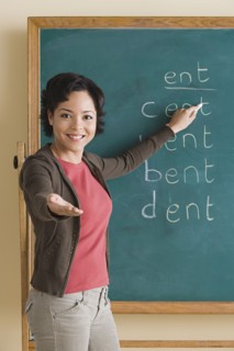Teacher showing words on blackboard. Photo : Rob Lewine