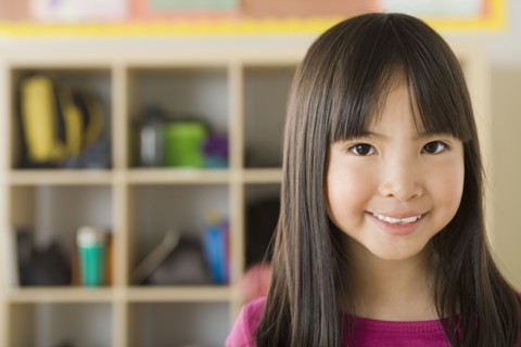 Portrait of girl (6-7) in school. Photo : Rob Lewine