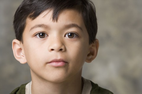 Portrait of boy (8-9), studio shot. Photo : Rob Lewine