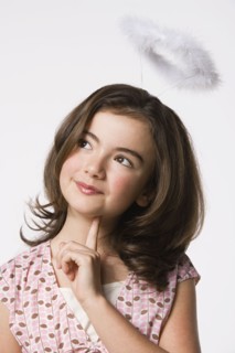 Girl (8-9) wearing halo, studio shot. Photo : Rob Lewine