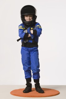 Studio portrait of girl (8-9) in crash helmet. Photo : Rob Lewine