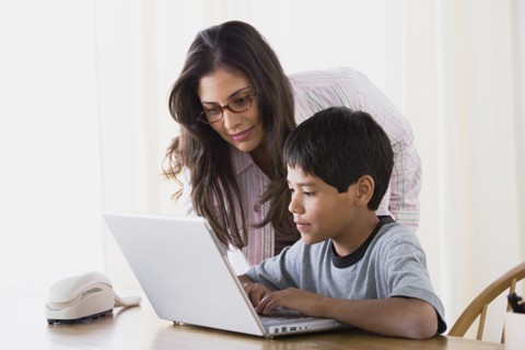 Mother doing homework with son (10-11). Photo : Rob Lewine
