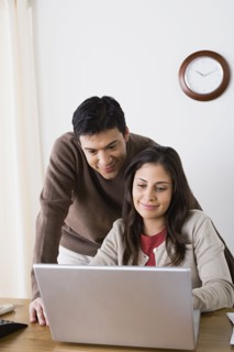 Couple doing paperwork at home. Photo : Rob Lewine