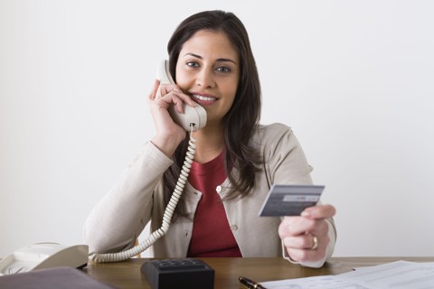 Portrait of smiling woman talking on phone. Photo : Rob Lewine