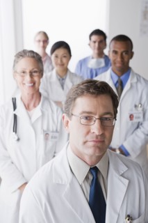 Group portrait of smiling doctors. Photo : Rob Lewine