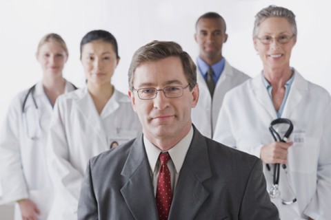 Group portrait of smiling doctors. Photo : Rob Lewine