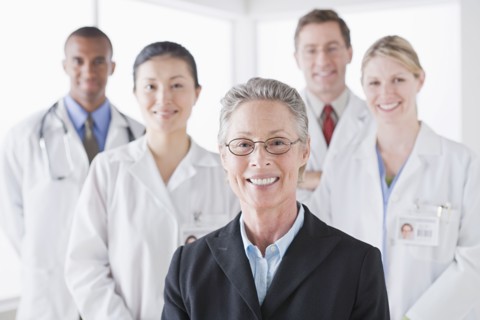 Group portrait of smiling doctors. Photo : Rob Lewine