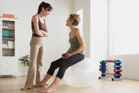 Women talking in gym. Photo : Rob Lewine