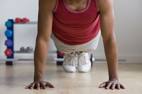 Close up of man doing push-ups. Photo : Rob Lewine