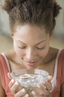 Woman relaxing with aromatherapy. Photo : Rob Lewine