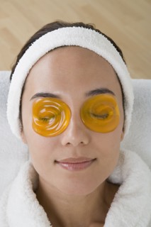 Woman relaxing with eye cooling mask. Photo : Rob Lewine