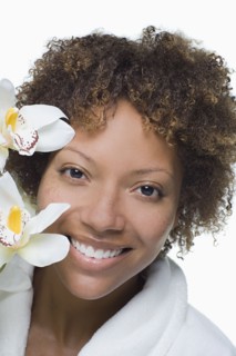 Portrait of attractive woman with tropical flowers. Photo : Rob Lewine