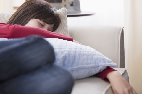 Woman sleeping o sofa. Photo : Rob Lewine