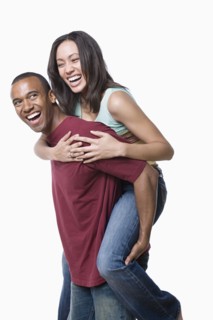 Portrait of young couple enjoying together. Photo : Rob Lewine