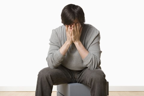 Studio portrait of young man crying. Photo : Rob Lewine