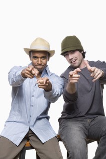 Studio portrait of two young men playing. Photo : Rob Lewine