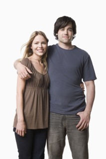 Studio portrait of young couple. Photo : Rob Lewine