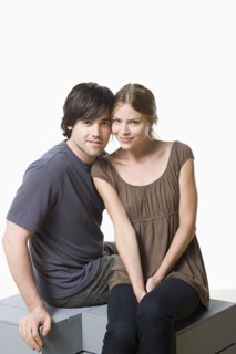 Studio portrait of young couple. Photo : Rob Lewine